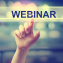 Webinar concept with hand pressing a button on blurred abstract background